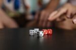 white and red dices on table