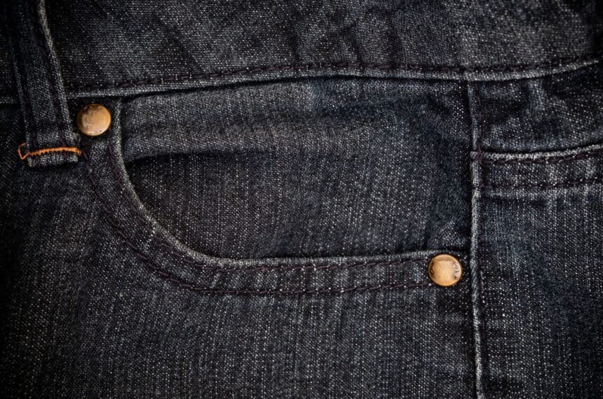 closeup view of blue jeans denim texture for traditional business background in cool vibrant colors