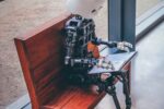 robot sitting on bench